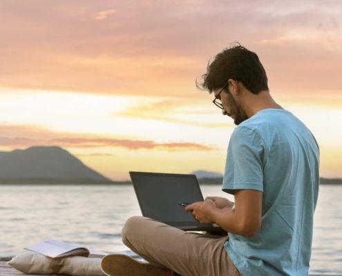 digital nomad on the beach