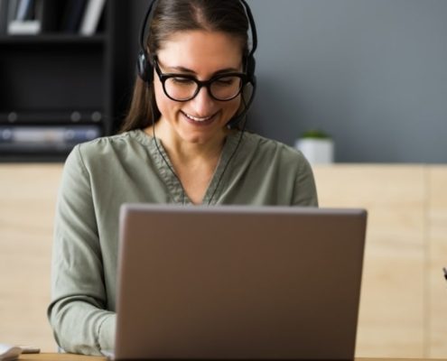 woman typing on a pc