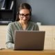 woman typing on a pc