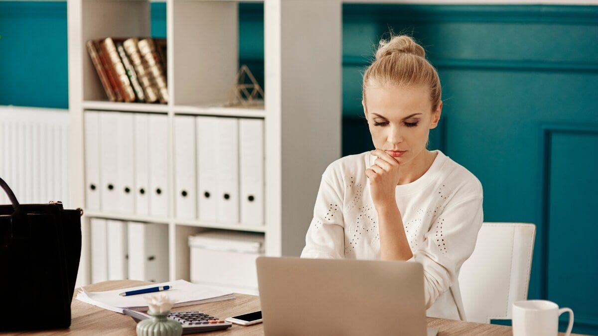 Professional working with focus on a laptop in a distraction-free workspace