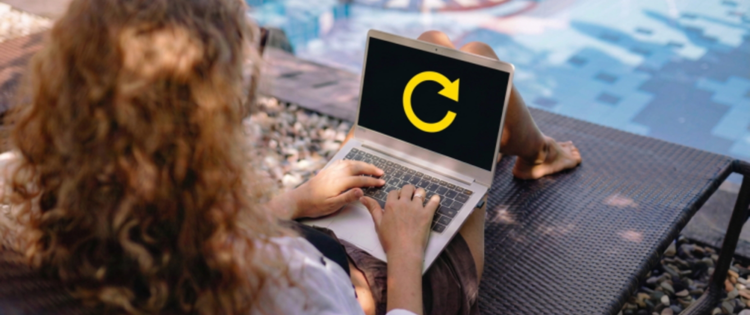 September Business Reset After Summer Woman refocusing on her business while working on a laptop by the pool